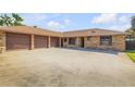 Spacious home with a three-car garage and large driveway at 1905 S Riverside Dr, Edgewater, FL 32141