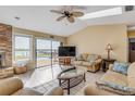 Comfortable living room with waterfront views through sliding glass doors at 1905 S Riverside Dr, Edgewater, FL 32141