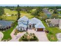 Expansive estate home with mature landscaping, paver drive, and golf course view in a desirable community at 2005 Country Club Dr, Port Orange, FL 32128