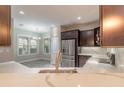 Modern kitchen with stainless steel appliances and white quartz countertops at 254 Cappella Ct, New Smyrna Beach, FL 32168