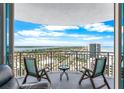 Relaxing balcony featuring seating and breathtaking views of the city skyline and waterfront at 2625 S Atlantic Ave # 18Nw, Daytona Beach, FL 32118
