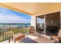 Condo balcony with furniture overlooking a beautiful waterway at 265 Minorca Beach Way, New Smyrna Beach, Florida at 265 Minorca Beach Way # 902, New Smyrna Beach, FL 32169