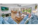 Inviting living room featuring tile floors, comfortable seating, and sliding glass doors at 2961 Oceans Trce, Daytona Beach Shores, FL 32118
