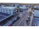 Aerial view of a commercial district with palm trees and street-side parking at 306 Sheldon St, New Smyrna Beach, FL 32168