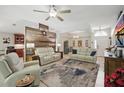 Spacious living room featuring tile flooring, recessed lighting, and comfortable seating at 3378 Leonardo Ln, New Smyrna Beach, FL 32168