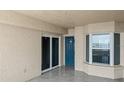 Private covered outdoor balcony with a tiled floor and glass sliding doors, perfect for enjoying the view at 3425 S Atlantic Ave # 902, Daytona Beach, FL 32118