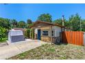Charming single-story home featuring stone accents and a blue front door at 428 Perdita Ave, Edgewater, FL 32132