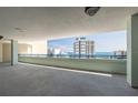 Balcony view to the ocean and adjacent building featuring a protective railing at 5300 S Atlantic Ave # 1-603, New Smyrna Beach, FL 32169
