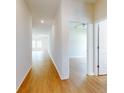 Hallway featuring wood-look flooring, connecting the living spaces and bedrooms at 534 Stowers Dr, New Smyrna Beach, FL 32168