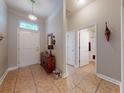 Spacious entryway featuring tile flooring and decorative accents leading to the living areas at 535 Coral Trace Blvd, Edgewater, FL 32132