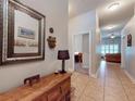 Inviting foyer featuring tile flooring and decorative elements leading into the home at 535 Coral Trace Blvd, Edgewater, FL 32132