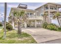Charming beach house with covered parking and a viewing deck for enjoying ocean views at 6320 S Atlantic Ave, New Smyrna Beach, FL 32169