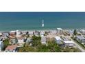 Aerial view of the light blue beach house in a coastal community, nestled near the ocean at 6871 S Atlantic Ave., New Smyrna Beach, FL 32169