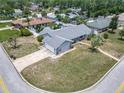 An aerial view showcases a charming single-story home with an attached garage and well-maintained lawn at 7 Heather Ln, Ormond Beach, FL 32174