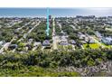 Aerial view showcases the proximity to the ocean of the neighborhood, beach access, and surrounding area at 804 E 12Th Ave, New Smyrna Beach, FL 32169