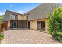 Beautiful back patio with screened lanai at 94 Cedar Dunes Dr, New Smyrna Beach, FL 32169