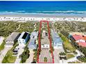 Aerial view of home and property with its beach access at 1421 N Atlantic Ave, New Smyrna Beach, FL 32169