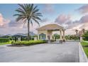 Gated Portofino Reserve community featuring manicured landscaping and controlled access for added security at 150 Portofino Blvd, New Smyrna Beach, FL 32168