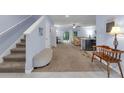 Spacious hallway leading to the living area with natural light and a neutral color palette creating a bright and airy feel at 1615 Primo Ct, Holly Hill, FL 32117