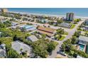 Beautiful aerial view of the neighborhood near the beach featuring mature trees and a sunny atmosphere at 2122 S Atlantic Ave # 2122, New Smyrna Beach, FL 32169