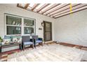 Enclosed brick patio featuring neutral paint, outdoor furniture, and plants, offering a cozy and inviting space at 25 Dolphin Ave, Ormond Beach, FL 32176