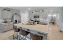 Well-equipped kitchen with stainless steel appliances, ample counter space, and light gray cabinetry at 2733 Neverland Dr, New Smyrna Beach, FL 32168