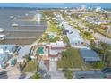 Stunning aerial view of a waterfront home with a private pool, lush landscaping, and scenic views at 2900 S Peninsula Dr, Daytona Beach, FL 32118
