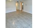 Bright living room with tile flooring, neutral walls, and ample natural light at 315 N Causeway # 2060, New Smyrna Beach, FL 32169