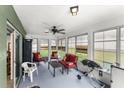 Enclosed sunroom with ample seating, ceiling fan, and lots of natural light coming through the windows at 3231 Bretton Woods Ter, Deltona, FL 32725