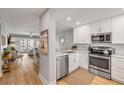 Modern kitchen with stainless steel appliances, marble countertops, and an open view to the living area at 4151 S Atlantic Ave # 3090, New Smyrna Beach, FL 32169