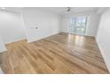 Bright living room with luxury floors, ceiling fan and plantation shutters at 4620 Riverwalk Village Ct # 7403, Ponce Inlet, FL 32127