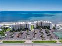 An aerial view of two beachside condo complexes with ample parking and access to the beach at 5201 S Atlantic Ave # 407A, New Smyrna Beach, FL 32169
