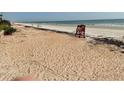 Lifeguard chair on a sandy beach with ocean views at 5201 S Atlantic Ave # 407A, New Smyrna Beach, FL 32169