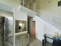 Entryway featuring a modern staircase and tiled floors at 6340 Engram Rd, New Smyrna Beach, FL 32169