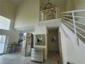 Entryway with tiled floors and modern staircase at 6340 Engram Rd, New Smyrna Beach, FL 32169