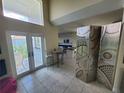 Bright open living space with tile floors and a balcony at 6340 Engram Rd, New Smyrna Beach, FL 32169