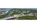Scenic aerial view showing the neighborhood, surrounding waterways and bridges, highlighting its desirable location at 653 Goodwin Ave, New Smyrna Beach, FL 32169