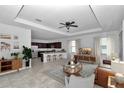 Open living room flows into the kitchen with island seating and stainless appliances at 7223 Sw 61St Pl, Ocala, FL 34474