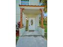 Inviting front porch with decorative accents, adding charm and curb appeal at 934 N Halifax Ave, Daytona Beach, FL 32118