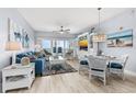 Living room featuring water view, comfortable seating, and stylish coastal decor at 2 Oceans West Blvd # 608, Daytona Beach Shores, FL 32118