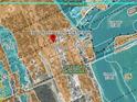 A detailed flood zone map of New Smyrna Beach indicates areas with varying degrees of flood risk, including Zone AE and Zone VE at 215 Alma Ct, New Smyrna Beach, FL 32168
