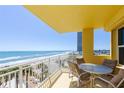 Condo balcony with seating and stunning ocean views for relaxing and enjoying the beach breezes at 2300 N Atlantic Ave # 203, Daytona Beach, FL 32118