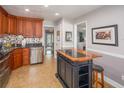 Charming kitchen featuring granite countertops, stainless steel appliances, and tile flooring at 2338 Tuscarora Trl, Maitland, FL 32751