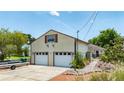 Large two-car garage with room for storage, side-entry door and trailer parking, and extra parking spaces at 235 Randle Ave, Oak Hill, FL 32759