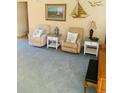 Comfortable living room with recliners, nautical decor, and natural light at 2672 Star Coral Ln, New Smyrna Beach, FL 32168