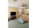 Bright living room featuring neutral paint, ceiling fans and comfortable seating at 2672 Star Coral Ln, New Smyrna Beach, FL 32168
