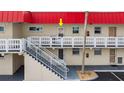 Condo with exterior stairs leading to a cozy, private balcony that overlooks the community at 2901 N Halifax Ave # 215, Daytona Beach, FL 32118