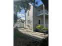 Side view of home and detached garage, showcasing the property's layout at 306 Murray St, New Smyrna Beach, FL 32168