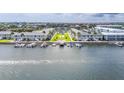 Aerial view showcases waterfront condos with boat docks and a community pool at 335 N Causeway # E3, New Smyrna Beach, FL 32169