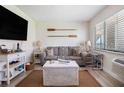 Cozy living room features a sofa, nautical decor, and natural light at 3509 S Atlantic Ave # 109, New Smyrna Beach, FL 32169